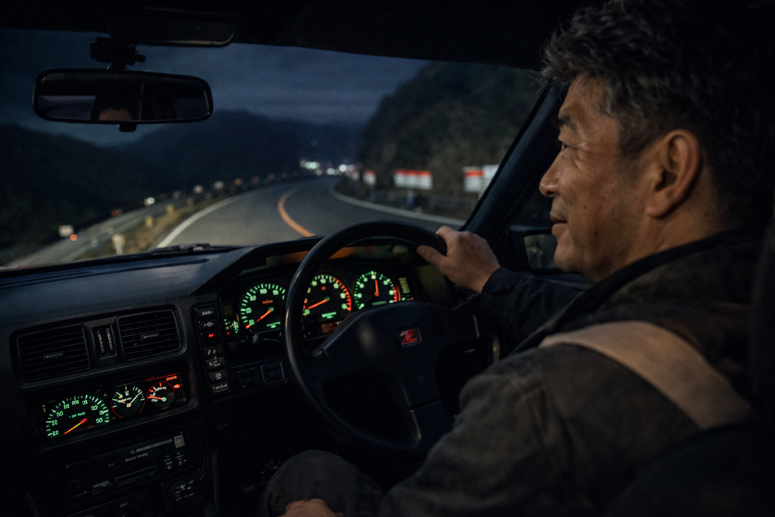 Passenger seat view inside a Fairlady Z Z31 driving through a mountain pass at night.
